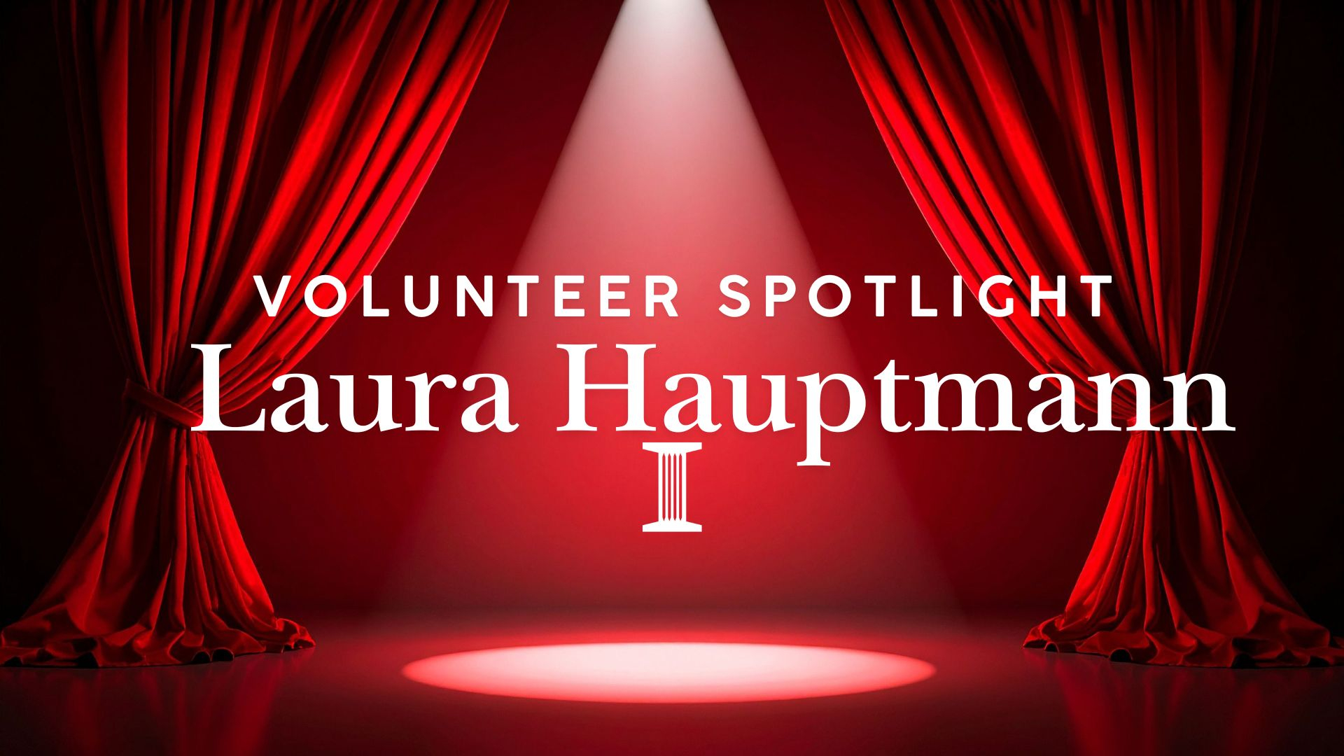 stage with curtain and spotlight on volunteer Laura Hauptmann