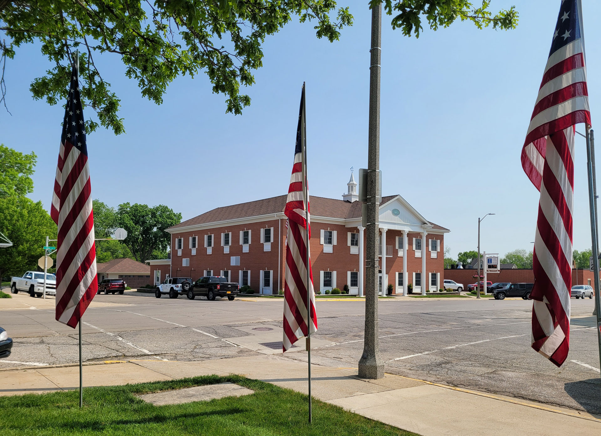 Summer Photo of Main Bank's Exterior with Flags