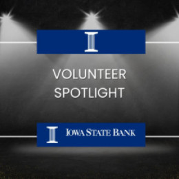 Stage with spotlight and Iowa State Bank