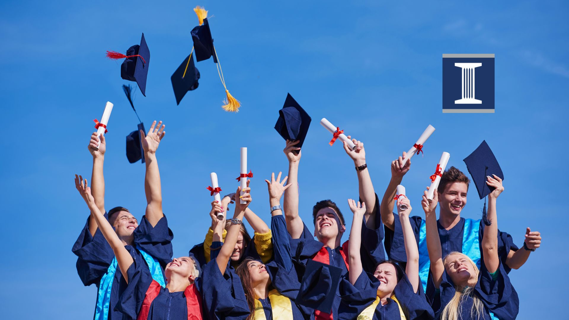 Graduates throwing caps at commencement