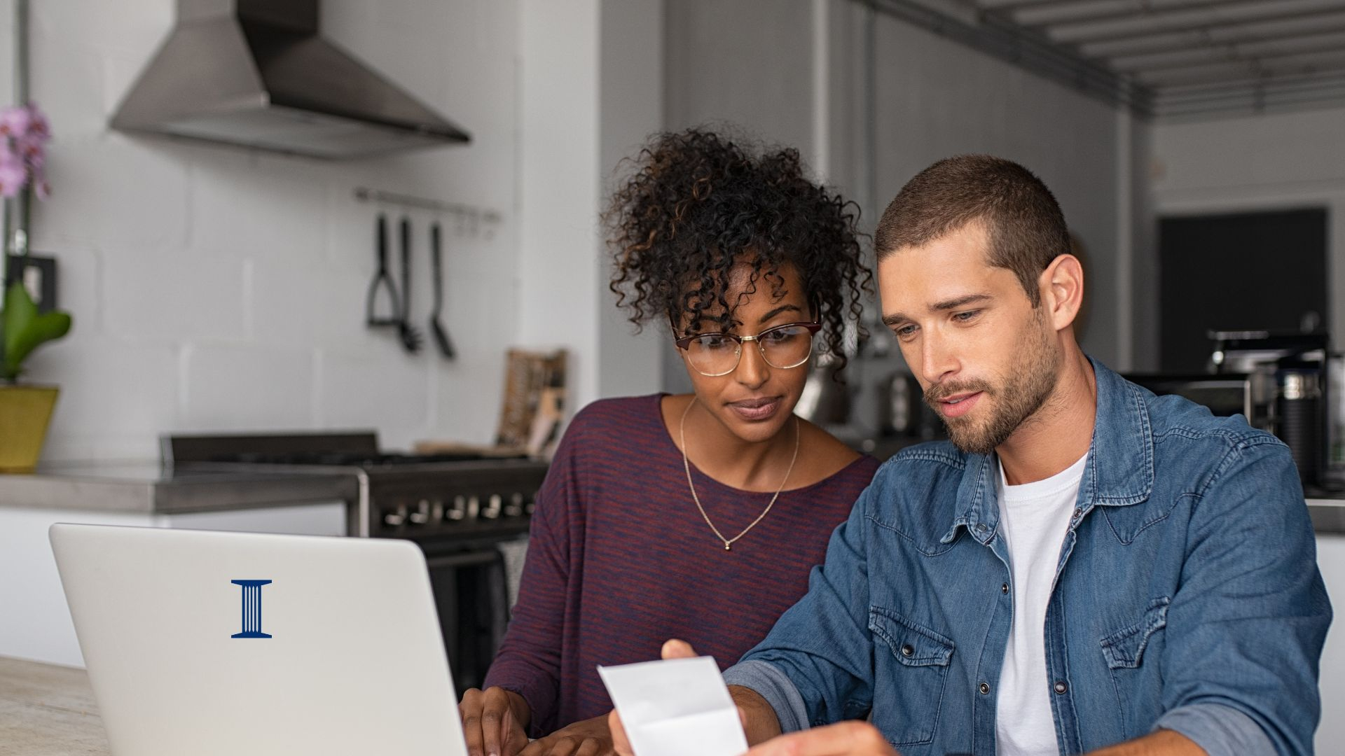 Couple with personal computer and financial documents